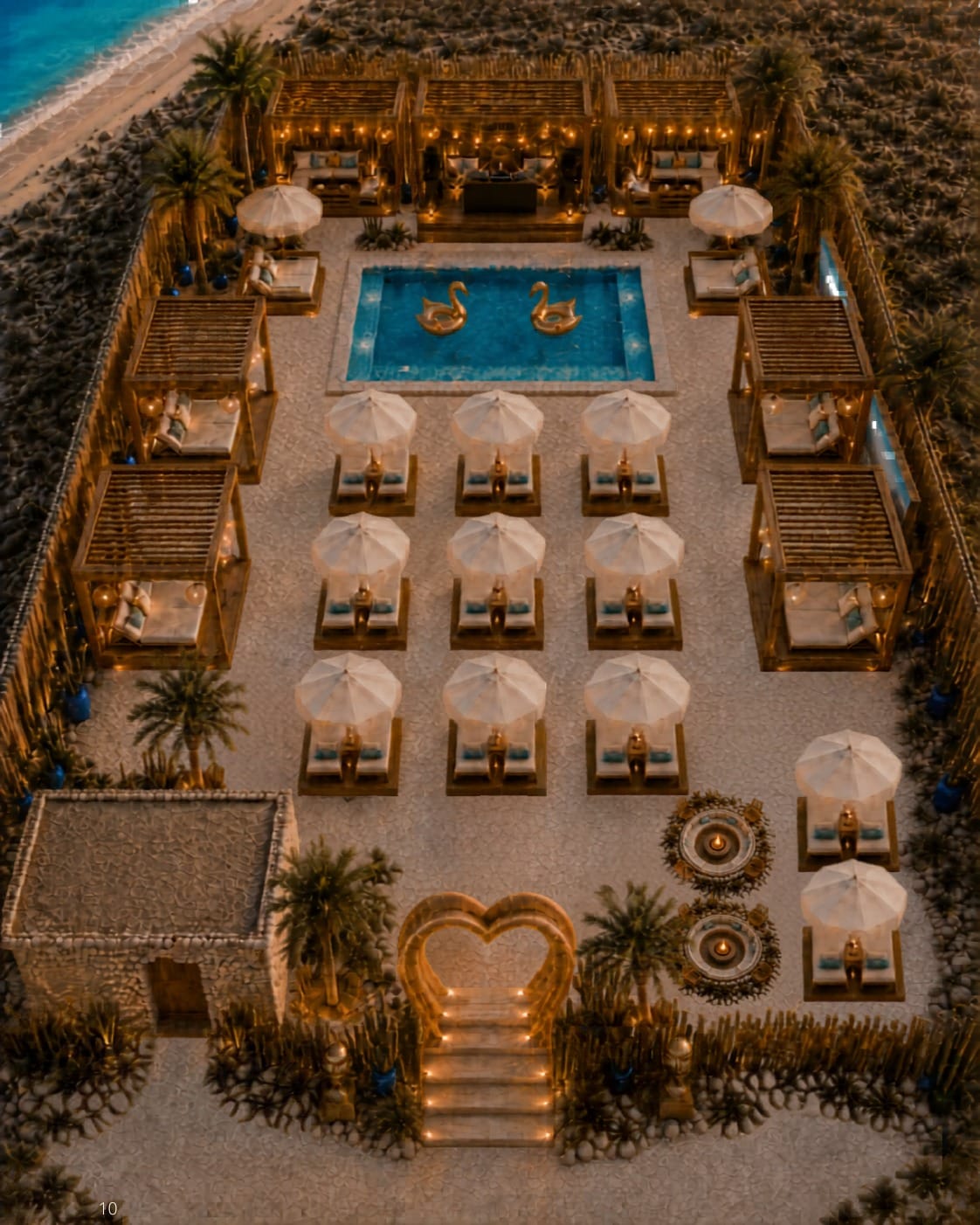 Beach club from above: pool with swans, umbrellas and cabanas